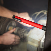 Magnetic led flashlight in use by a mechanic. 