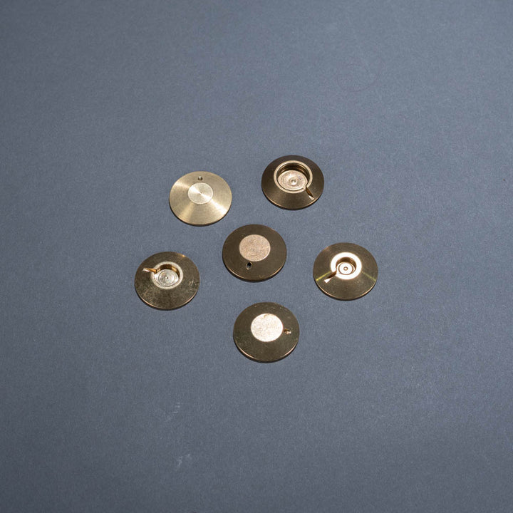 Brass bullet hit shield protective backings