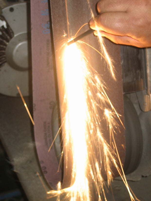 Sparks from flint rod. 
